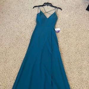 NWT long teal dress with slit!
Perfect for prom or college formal! l
